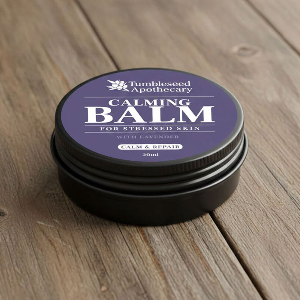 Tumbleseed Apothecary Calming Balm 30ml tin on a wooden surface